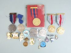 A small collection of military ephemera including enamel badges, commemorative medals etc