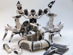 Four Wow Wee robots comprising Roboboa, two Roboquad and Robosapien.