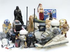 A large collection of Star Wars figures, vehicles and accessories including alarm clock, tapes,