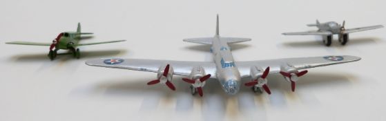 Three Meccano Dinky and Schuco diecast model aeroplanes comprising Long Range Bomber, Light Tourer
