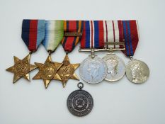 Royal Navy WWII medals comprising 1939-1945 Star, Atlantic Star, Burma Star with Pacific clasp,