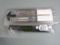 An air rifle cleaning kit and a Bisley No.3 air rifle silencer, both new in original packaging