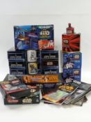 Twenty six Star Wars related items including Monopoly, book and cassette packs, mugs etc, most in