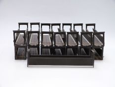 Fifteen 00 gauge locomotive carriers with built-in track