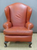 Leather style upholstered wing back chair