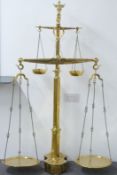 19thC Portuguese brass bull's head double floor standing beam scale, with weights to base from 5kg