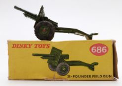 Dinky Toys diecast model 25-Pounder Field Gun with green body and hubs 686, in original box.