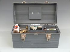 A collection of shotgun cleaning kit and accessories including gun snakes, snapcaps, choke measures,