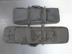 Two padded gun travel cases each with multiple pockets, one 114cm the other 86cm long, both new