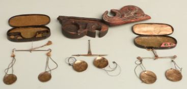 Three cased sets of travelling beam scales, one including George III coin weights