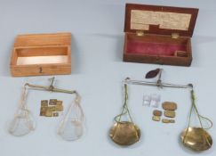 Two sets of 19thC travelling beam scales, one with list of weights to interior of lid. Width of case