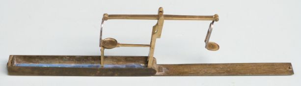 Georgian brass cased folding guinea or similar scale, the case with engraved decoration. L15cm