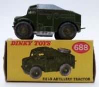 Dinky Toys diecast model Field Artillery Tractor with green body and hubs 688, in original box.