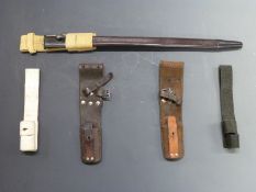 Five assorted bayonet frogs and one scabbard