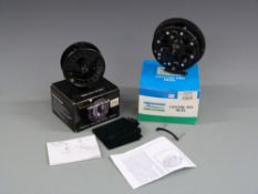 Snowbee Prestige large Arbor fly reel together with a Shakespeare Eagle wide centre pin reel