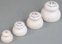A run of four ceramic bun weights from 2lb to 1/4lb, the largest three marked Imperial Enamel
