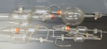 A quantity of scientific or laboratory glassware comprising nine pieces in total, some marked Pyrex,