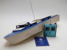 A wooden remote control model boat with MacGregor Digimac II transmitter and control manual, 90cm