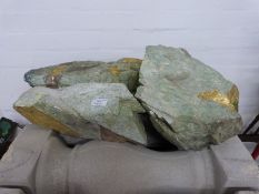 Three pieces of decorative stone with gold streaks