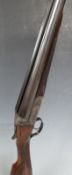 W W Greener 12 bore side by side ejector shotgun with named and engraved locks, chequered grip and