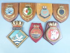 Royal Navy seven ship wall plaques comprising Vernon, Hydra, Queen Elizabeth, Aurora, Newcastle,