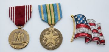 United States of America medals comprising a Good Conduct Medal and Outstanding Volunteer Service