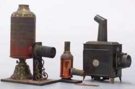 Three magic lantern type projectors including one marked A W Gammage Ltd