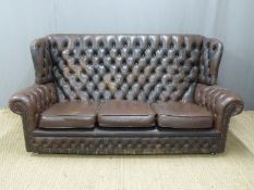 Brown leather Chesterfield sofa, length 184cm