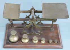 Victorian brass postage scales with rates to pan and bun-shaped weights to base from 8oz