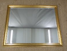 Gilt framed mirror with bevelled glass, 132 x 103cm overall