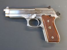 Deactivated Taurus PT99 AFS 9mm PARA semi-automatic pistol with chequered wooden grips, alignment