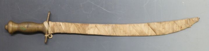 A brass hilted sword with fabric bound blade, possibly Eastern / Indian