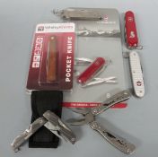 Three Swiss Army knives, a British Army clasp knife and a Whitby knife together with a Gerber