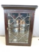 A 19thC astragal glazed corner cupboard with shaped shelves and mirrors behind, W90 x H122cm