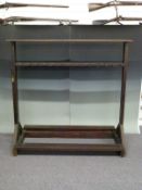 A double sided gun rack or display stand, L150cm x D70 x H137cm