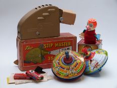 Chad Valley Humming Spinning top together with one similar, a Mattel Jack In the Music Box and The