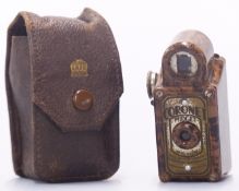 Coronet Midget brown bakelite miniature camera in leather pouch