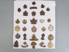 Approximately 30 WWI/WWII Canadian Army cap badges/ insignia including Cameron Highlanders,