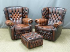 Pair of oxblood leather Chesterfield armchairs and footstool