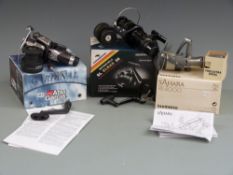 Three fixed spool reels comprising Shimano Sahana RE4000, Abu Garcia Cardinal 405i free runner and a