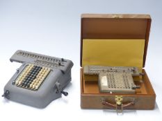 Two vintage mechanical calculators, one Madas the other a Monroe example in case