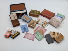 A collection of vintage games and playing card accessories including whist markers, card boxes,