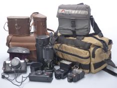 Pentax MG SLR camera with 1:2 50mm lens, Tamron 80 - 210mm lens, two flashes, a Canon Telemax