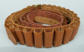 Two canvas and leather 12 bore shotgun cartridge belts