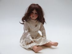 Armand Marseille bisque headed doll with open mouth, weighted blue eyes, long brown hair and