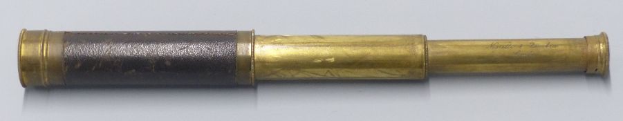 Negretti & Zambra brass two draw leather bound telescope.