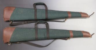 Two Napier of London padded leather and canvas shotgun slips with shoulder strap, 127cm long.