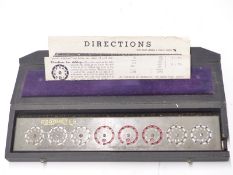 Addometer vintage mechanical calculator with instructions and stylus, in original case, length 31cm