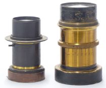 Two projector studio or similar lenses, one f 8, the other indistinct