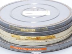 Three vintage Laurel & Hardy 16mm cine film reels marked 'Love 'em & Weep', 'Hog Wild' and 'The
